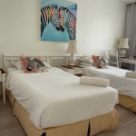 2-bedroom condo in Laguna Phuket twin bed with yellow bedskirt PSC-LAG-1598