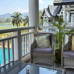 2-bedroom condo in Laguna Phuket covered terrace with wicker seats overlooking pool PSC-LAG-1598