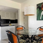 2-bedroom condo in Laguna Phuket kitchen and round glass dining table with 4 blakc wicker chairs PSC-LAG-1598