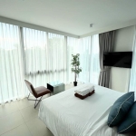 2-bedroom condo near Laguna Beach in Bang Tao, Phuket bedroom with floor to ceiling glass walls and windows PSC-BAN-1595