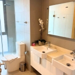 2-bedroom condo near Laguna Beach in Bang Tao, Phuket toilet and bath with his and hers sinks PSC-BAN-1595
