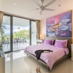 2-bedroom condo near Surin and Bang Tao Beach bedroom with purple bedding and balcony access PSC-SUR-1606