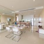 2-bedroom condo near Surin and Bang Tao Beach dining and kitchen area with mirror wall panels PSC-SUR-1606