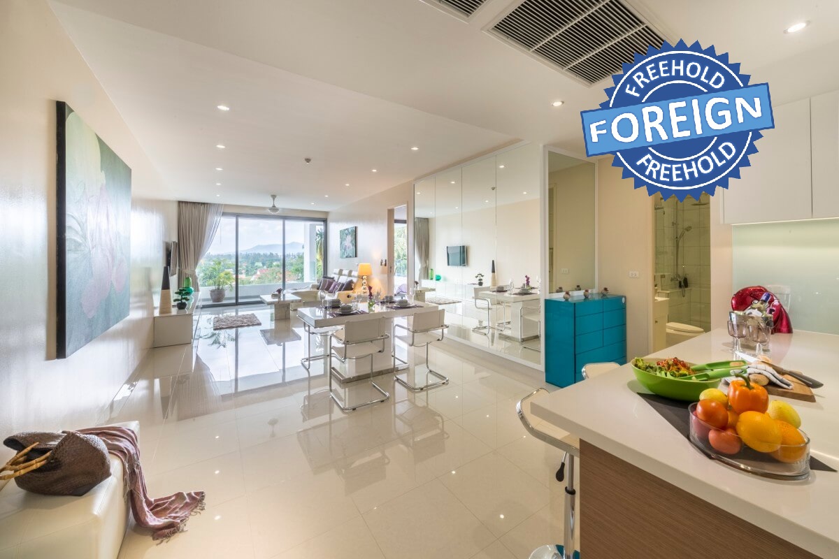 2-bedroom condo near Surin and Bang Tao Beach dining and living area with terrace PSC-SUR-1606