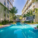2-bedroom condo near Bang Tao Beach, Phuket exterior shot with large shared pool PSC-BAN-1597