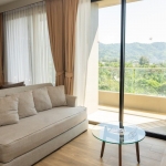 2-bedroom condo near Bang Tao Beach, Phuket living and dining area with balcony PSC-BAN-1597