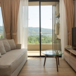 2-bedroom condo near Bang Tao Beach, Phuket living room and balcony PSC-BAN-1597