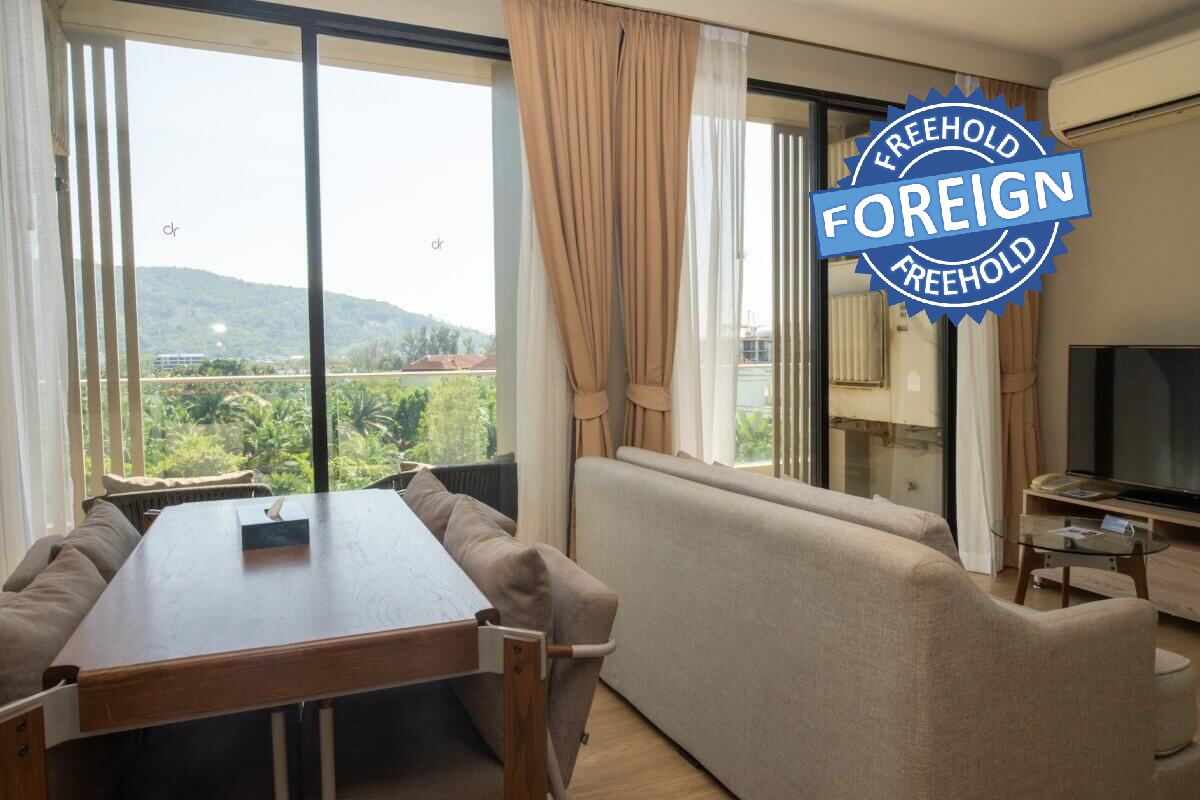 2-bedroom condo near Bang Tao Beach, Phuket living and dining area with mountain views PSC-BAN-1597