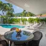 2-bedroom pool villa in Soi Naya, 5 minutes to Nai Harn Beach, Phuket undercover poolside area with dining and lounging furniture PSV-NAH-1607