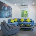 2-bedroom pool villa in Soi Naya, 5 minutes to Nai Harn Beach, Phuket living room blue couch with lime green throw pillows PSV-NAH-1607