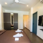 2-bedroom pool villa in Soi Naya, 5 minutes to Nai Harn Beach, Phuket bedroom with ensuite bathroom and blue door PSV-NAH-1607