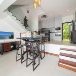 2-bedroom duplex condo in Laguna, Phuket dining area and steps leading to kitchen PSC-LAG-1594