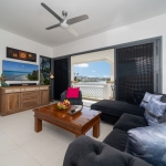 2-bedroom duplex condo in Laguna, Phuket living area with lakeview and terrace access PSC-LAG-1594