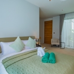 3-bedroom pool villa near Blue Tree in Cherng Talay, Phuket bedroom wtih beige armchair PSV-CHE-1589