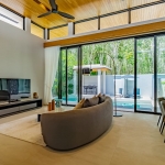 3-bedroom pool villa near Blue Tree in Cherng Talay, Phuket living and dining area with ribbon windows and pool access PSV-CHE-1589