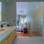 3-bedroom pool villa near Blue Tree in Cherng Talay, Phuket bedroom with sliding glass door to ensuite bathroom PSV-CHE-1589