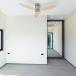 3-bedroom pool in Soi Samakki, Rawai, Phuket vacant room with white walls and ceiling fan PSV-RAW-1596