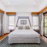 3-bedroom pool villa for sale in Laguna, Phuket king bedroom with blue patterned rug and balcony access PSV-LAG-1579