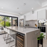 3-bedroom pool villa for sale in Laguna, Phuket kitchen with breakfast island and bar stools PSV-LAG-1579