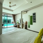 4-bedroom pool villa near Friendship Beach in Rawai, Phuket bedroom with lime green throw pillows and pool access PSV-RAW-1590