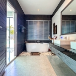 4-bedroom pool villa near Friendship Beach in Rawai, Phuket bathroom with freestanding bathtub and black wall tiles PSV-RAW-1590