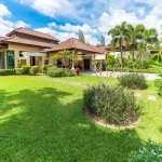 4-bedroom pool villa near Bang Tao Beach, exterior view with manicured lawn and garden PSV-BAN-1585