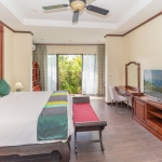 4-bedroom pool villa near Bang Tao Beach, Phuket bedroom with red bench bed and garden access PSV-BAN-1585