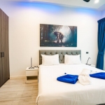 4-bedroom pool villa in Soi Samakki, Rawai Phuket bedroom elephant painting over bed PSV-RAW-1583