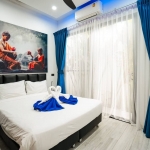 4-bedroom pool villa in Soi Samakki, Rawai Phuket bedroom with royal blue curtains PSV-RAW-1583