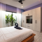 4-bedroom pool villa near Rawai & Nai Harn Beaches in Phuket bedroom with built-in cabinet and tv PSV-RAW-1602