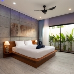 4-bedroom pool villa near Rawai & Nai Harn Beaches in Phuket bedroom with buddha painting and sliding glass door PSV-RAW-1602