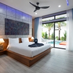 4-bedroom pool villa near Rawai & Nai Harn Beaches in Phuket bedroom with white corner vase and pool access PSV-RAW-1602