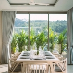 5-bedroom pool villa for sale near Kamala Beach, Phuket dining area with glass walls and mountain view PSV-KAM-1587