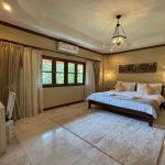 5-bedroom pool villa in Chalong, Phuket bedroom with chandelier, marble floors and cream rug PSV-CHA-1584