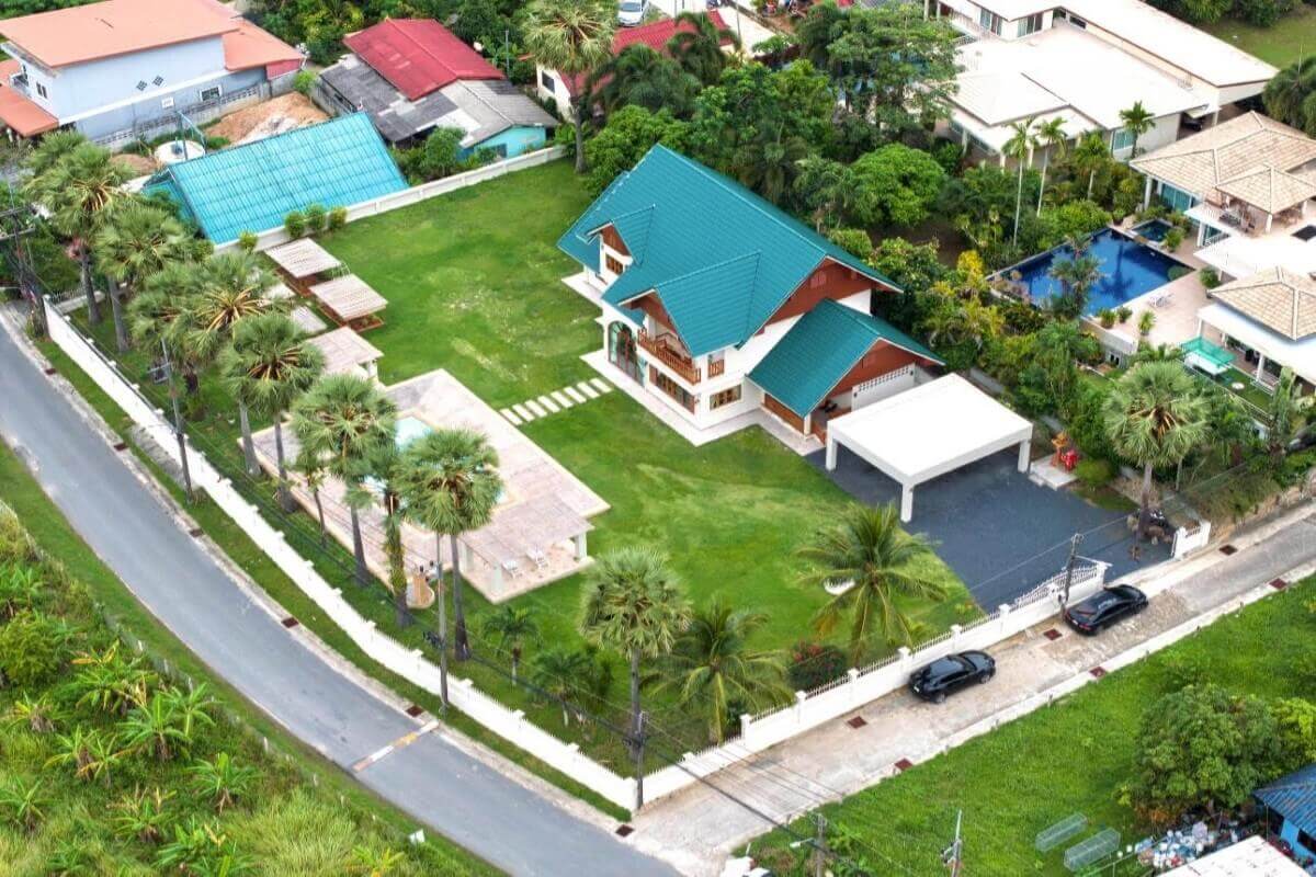 5-bedroom pool villa in Chalong, Phuket aerial view showing the villa on a large plot PSV-CHA-1584